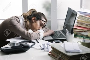 17799998-tired-businesswoman-sleeping-on-the-desk-in-front-of-the-computer-screen-.jpg